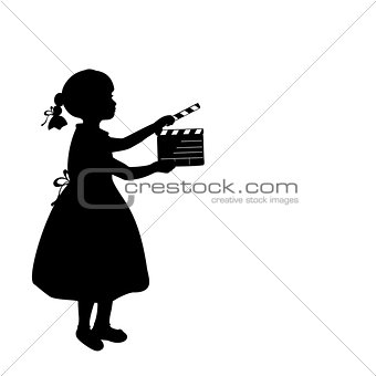 Silhouette girl makes movies film camera.