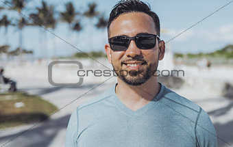 Casual young man in sunglasses