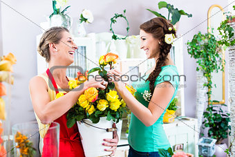 Florist woman and customer in flower shop