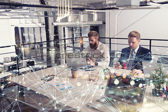 Business people that work together in office at the night. Concept of teamwork and partnership. double exposure