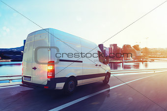 Van run fast on the highway to deliver. 3D Rendering
