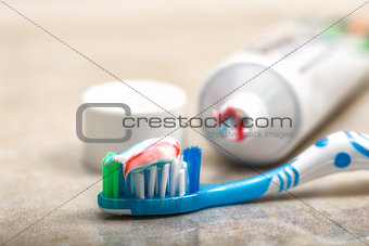 Toothbrush and toothpaste on the shelf