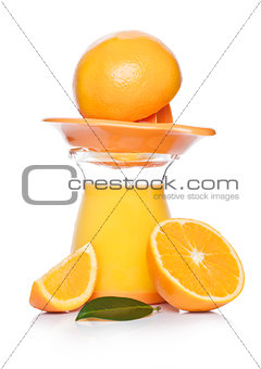 Fresh raw peeled oranges with juice squeezer jar