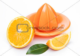 Fresh raw peeled oranges with juice squeezer 