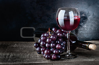 Wine with grapes and bottle