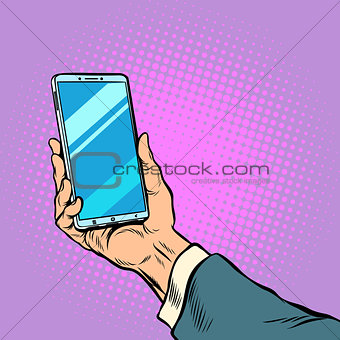 Smartphone in male hand selfie