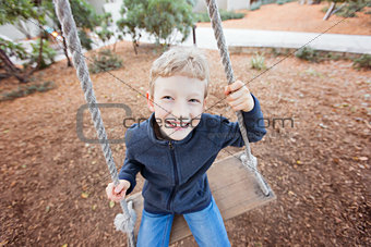kid at swings