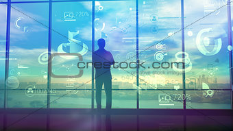 A man observes business processes on infographic