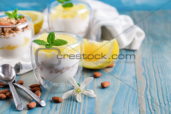 Yogurt with granola and grapefruit background