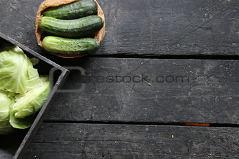 Fresh cucumbers on a old wooden kitchen table