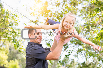 Young Caucasian Father and Daughter Having Fun At The Park