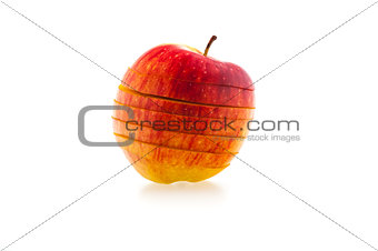 one sliced red juicy apple on a white background