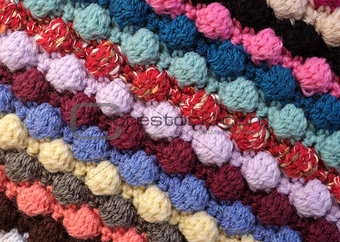 Diagonal stripes of multi-coloured bobble crochet stitches backg