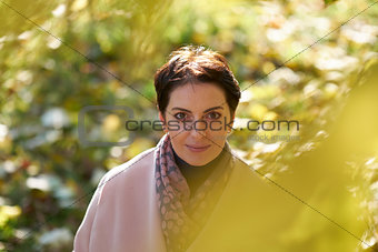 Woman in autumn yellow leaves