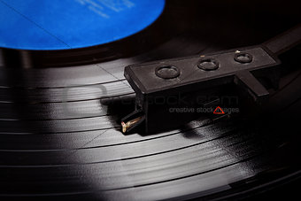 Turntable stylus on a vinyl record