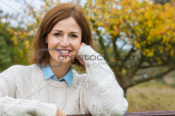 Attractive Happy Middle Aged Woman Resting on Fence