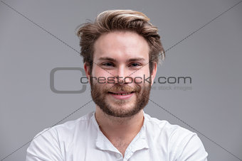 Portrait of a handsome blond young man smiling