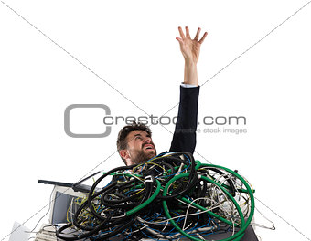 Businessman trapped by cables. concept of stress and overwork