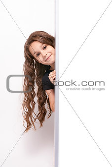 Little girl. White board. Light background