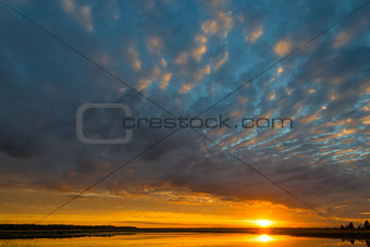 beautiful clouds during sunset over the picturesque lake