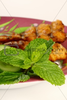 close up of fresh green mint leaves on food